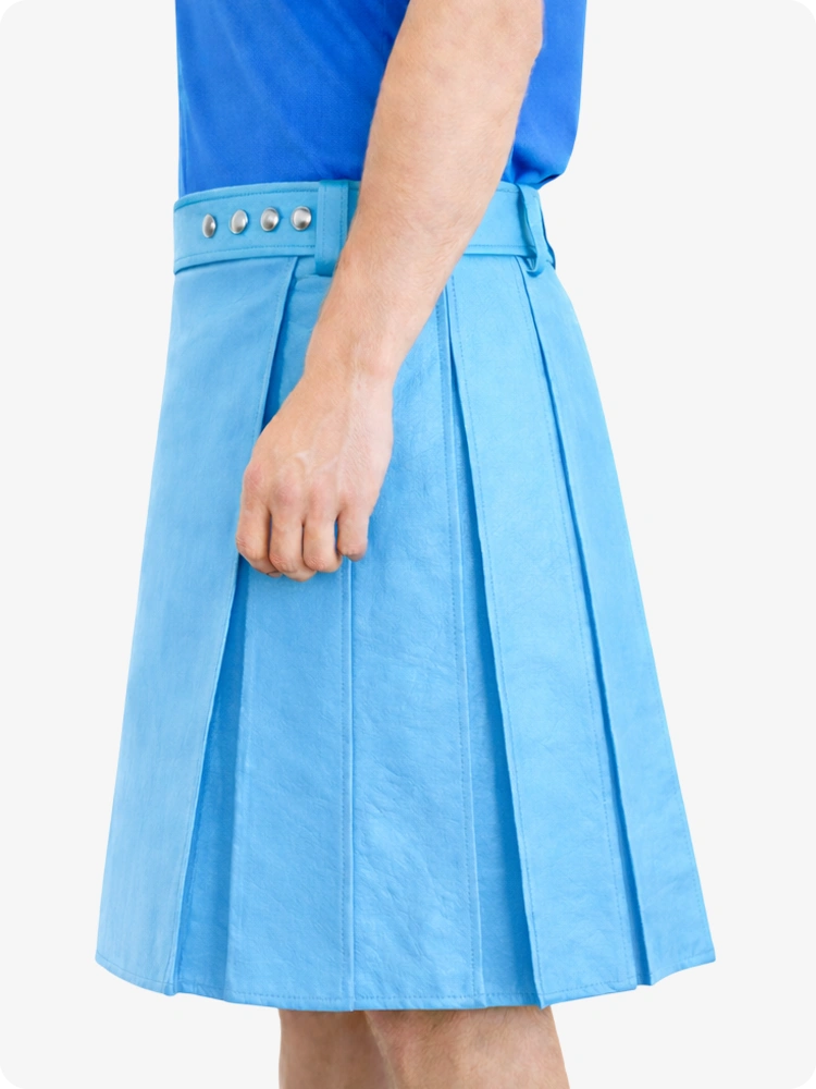 Sky blue skirt with studded details worn by a person on a white background