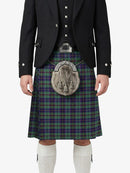 Person wearing a black jacket, green plaid kilt, and white socks on a white background