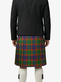 Person wearing a black jacket and a colorful plaid kilt on a white background