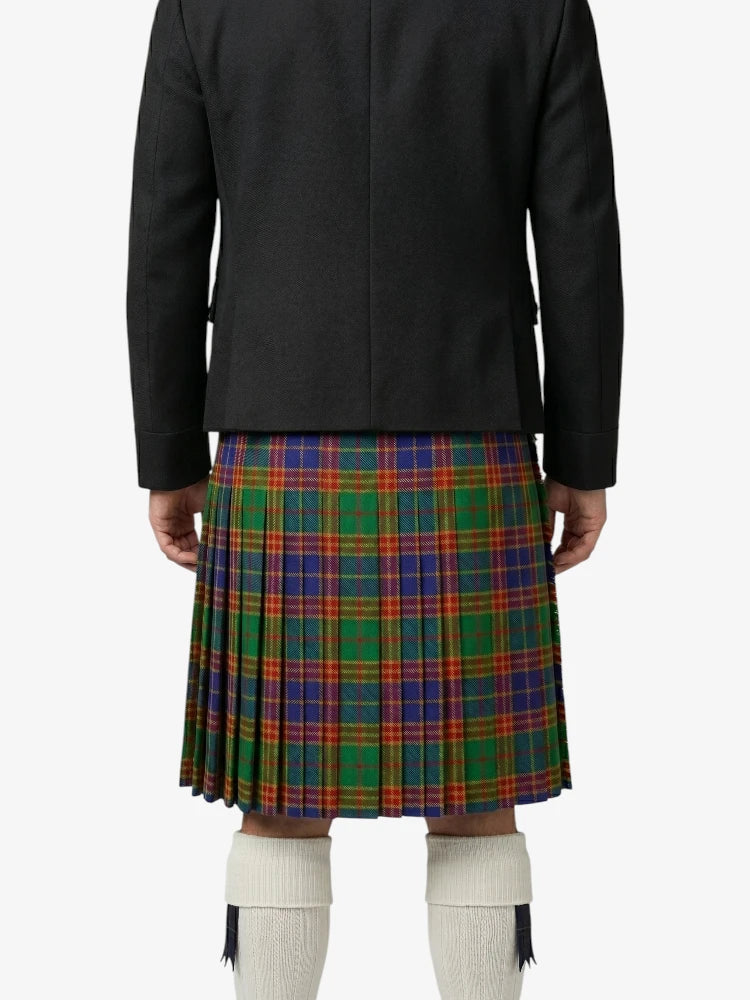 Person wearing a black jacket and a colorful plaid kilt on a white background