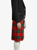 Person wearing a black jacket and red plaid kilt on a white background