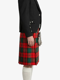 Person wearing a black jacket and red plaid kilt on a white background