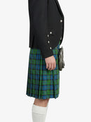 Person wearing a black jacket and green plaid kilt on a white background