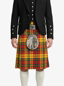 Person wearing a black jacket and a colorful plaid kilt on a white background