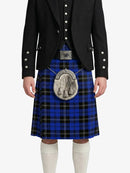 Person wearing a blue plaid kilt with a black jacket on a white background