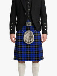 Person wearing a blue plaid kilt with a black jacket on a white background