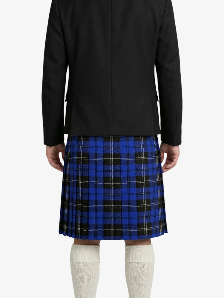 Person wearing a black jacket and blue plaid kilt on a white background
