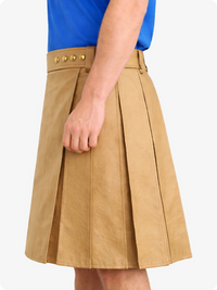 Tan skirt worn by a person on a white background
