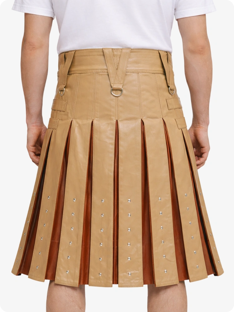 Tan pleated skirt with decorative elements on a white background