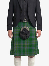 Person wearing a green plaid kilt with a matching jacket on a white background