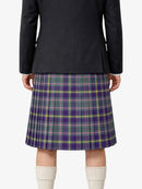 Person wearing a black jacket and plaid kilt on a white background