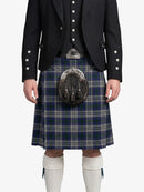 Person wearing a traditional Scottish kilt with a sporran on a white background