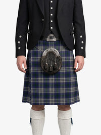Person wearing a traditional Scottish kilt with a sporran on a white background
