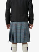 Person wearing a black jacket and blue plaid kilt on a white background