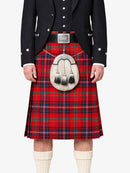 Person wearing a red tartan kilt with a black jacket and white socks on a white background