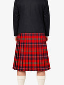 Person wearing a black jacket and red plaid kilt on a white background