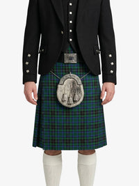 Person wearing a black jacket, green plaid kilt, and white knee-high socks on a white background