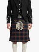 Person wearing a black jacket and tartan kilt on a white background