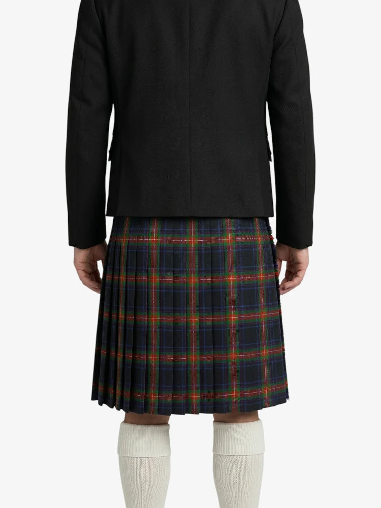 Person wearing a black jacket and plaid kilt on a white background