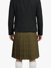 Person wearing a black jacket and green plaid kilt on a white background