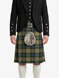 Person wearing a traditional Scottish kilt with a jacket on a white background